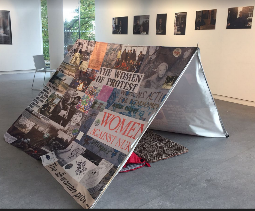A mock up of a tent made up of images from Greenham Women's Peace Camp